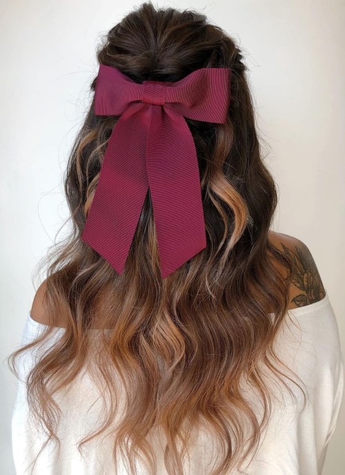 Loose Curls and Statement Bow Hairstyle