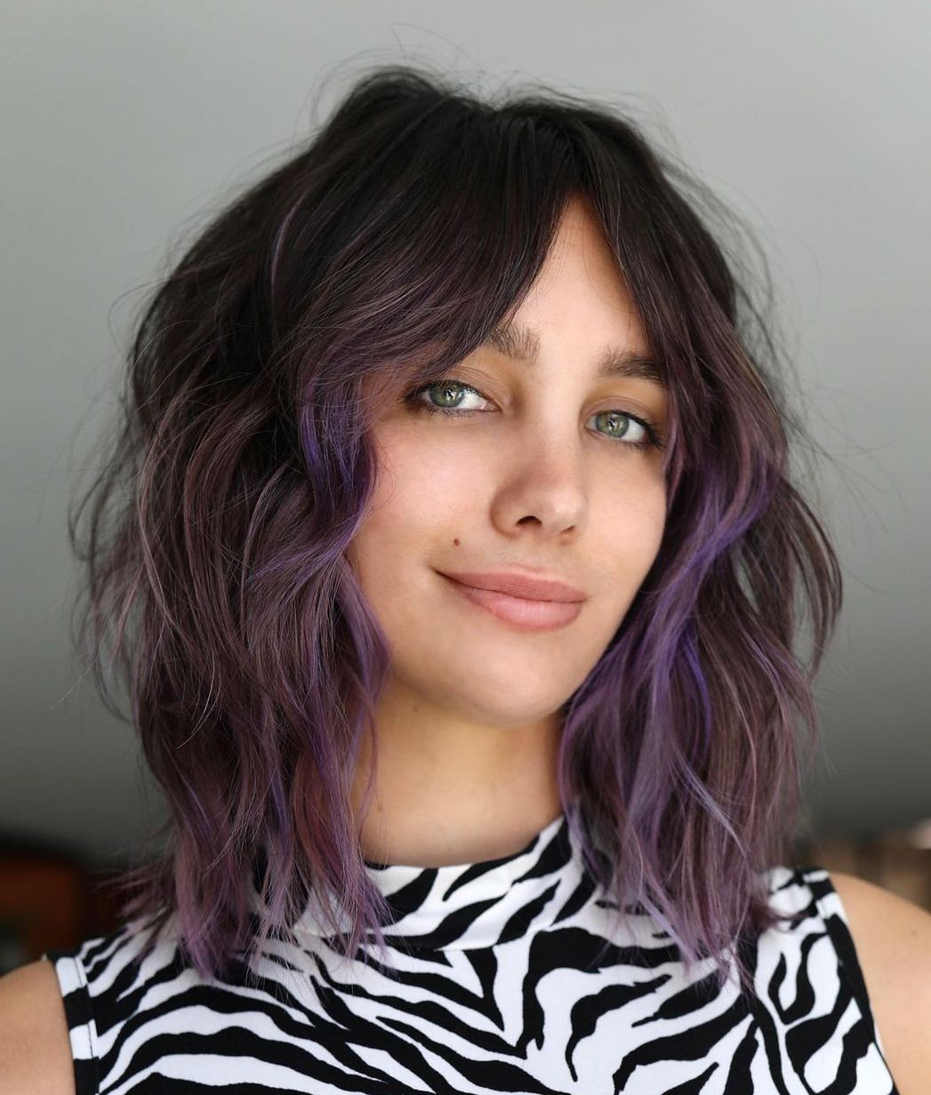 Messy Bob with Curtain Bangs and Purple Highlights