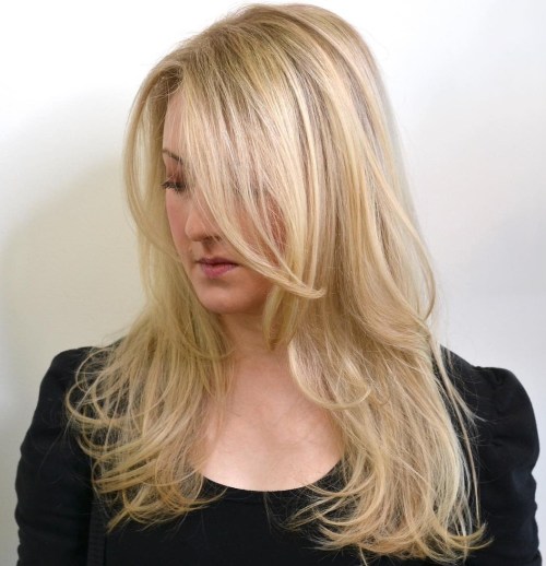 Layered Blonde Hairstyle With Long Side Bangs