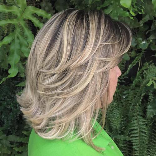 Mid-Length Feathered Ash Blonde Hairstyle