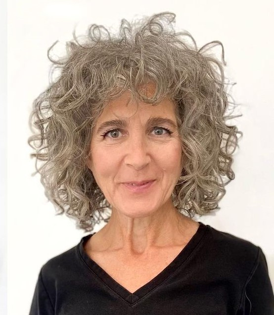 Ash Blonde Curly Bob with Bangs for Older Women