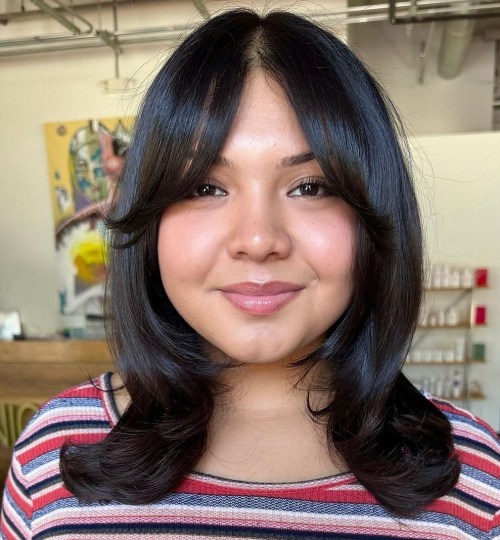 Medium Middle Part Hairstyle with Curtain Bangs