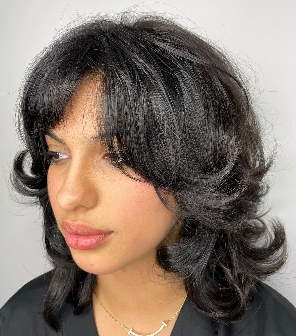 Lovely Feathered Cut for Wavy Hair