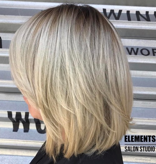 Blonde Layered Bob With Stretched Roots