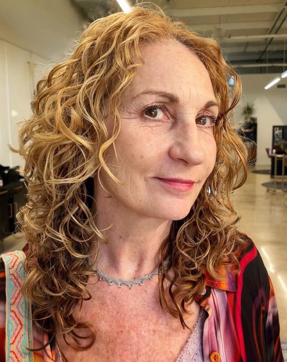 Layered Hairstyle for Women over 50 with Loose Curls