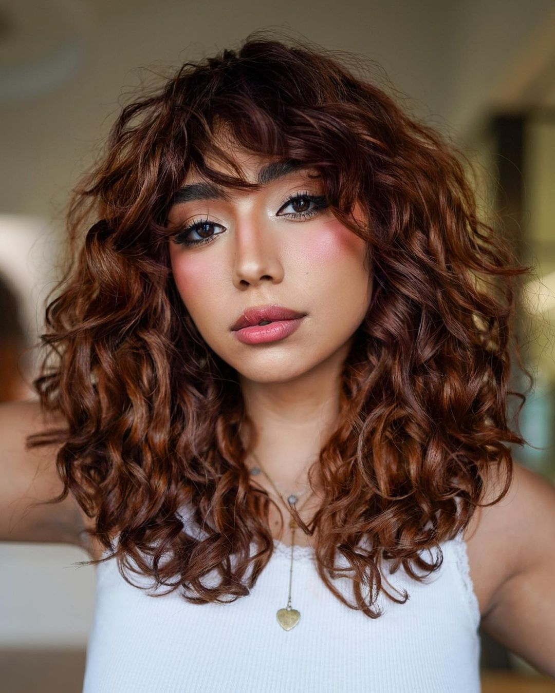 Reddish Layered Haircut for Curly Tresses