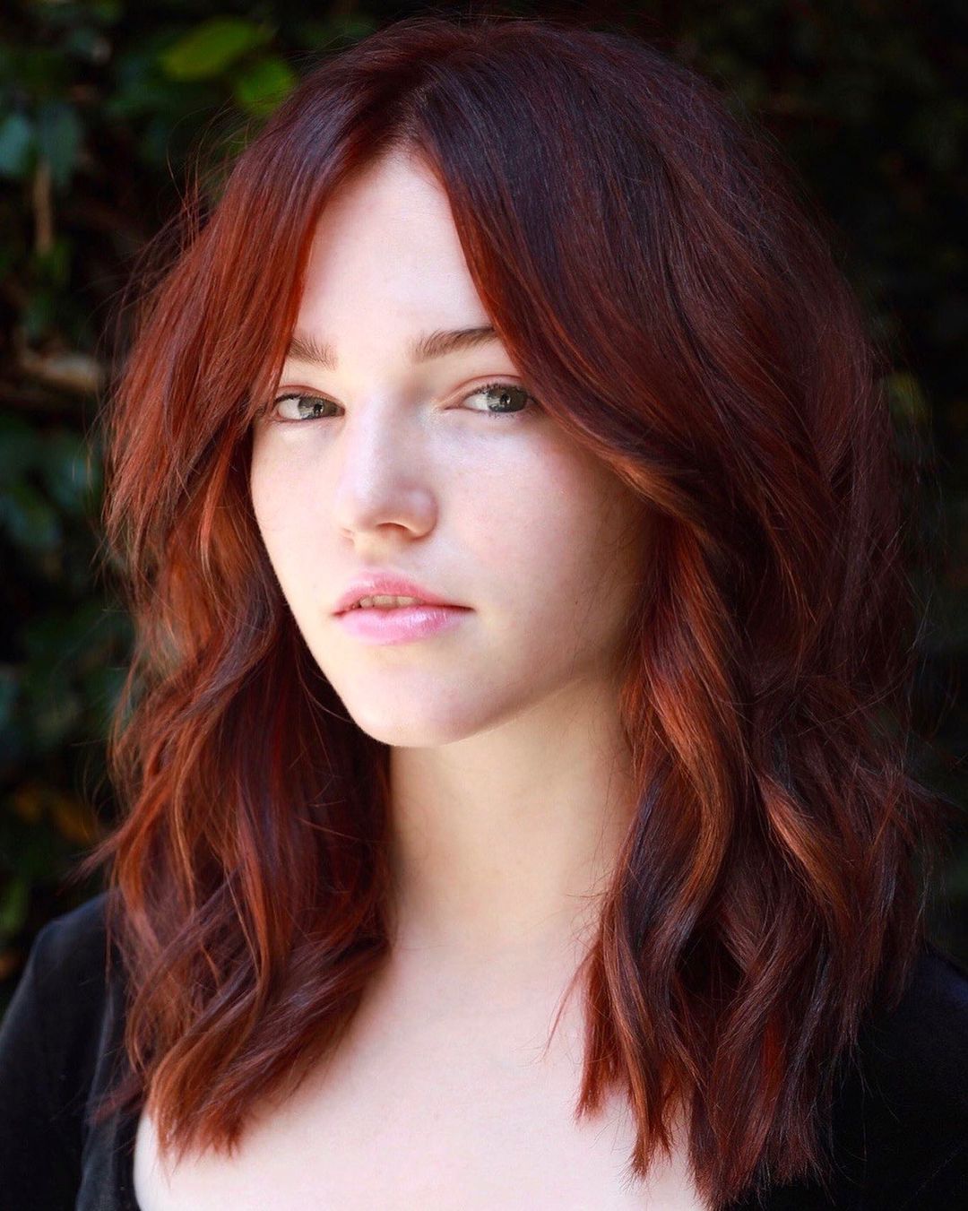 Wine Red Hair with Subtle Face Framing Highlights