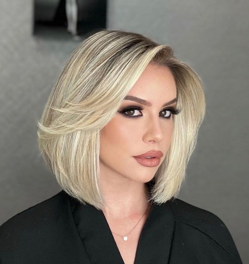 Bright Blonde Rounded Bob with Long Feathered Bangs
