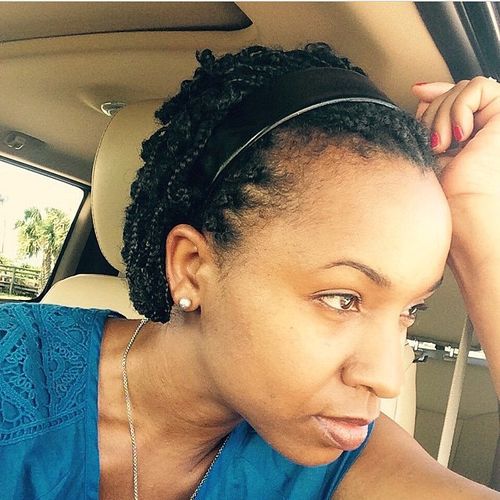 braided natural hair style with a headband