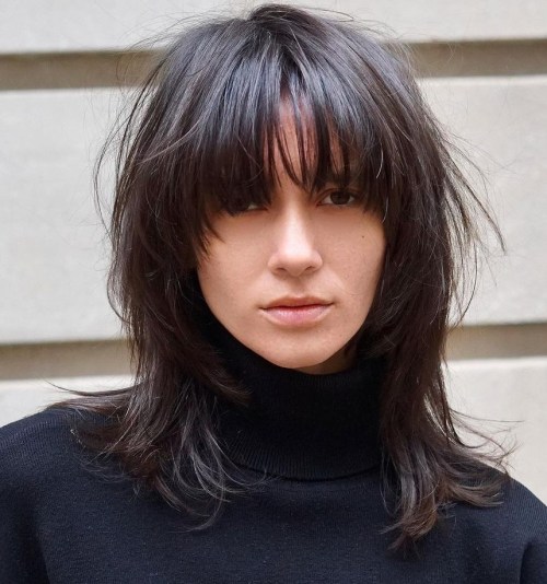 Mid Length Haircut with Front Layers and Arched Bangs
